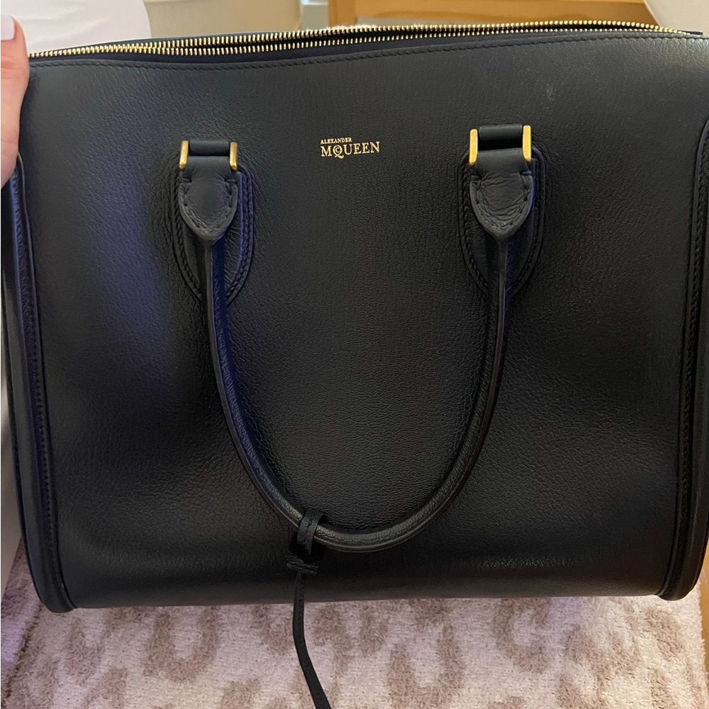 Navy blue Alexander McQueen selling this item to make room in my closet :)